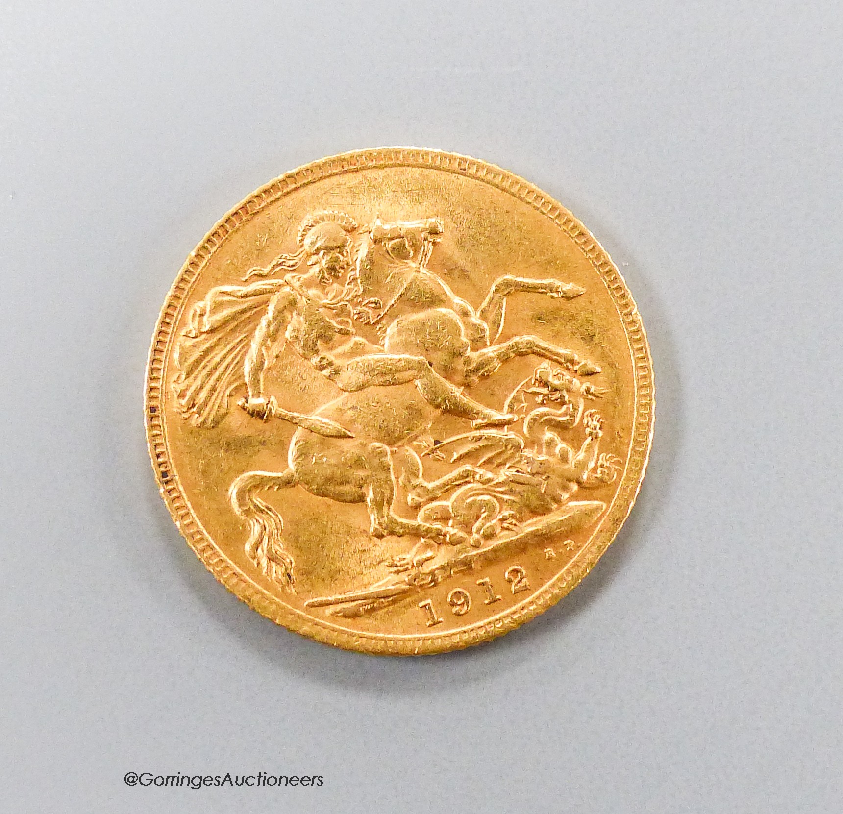 A George V 1912 gold sovereign, GVF.